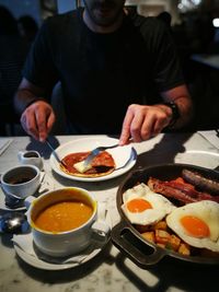 Midsection of man having food