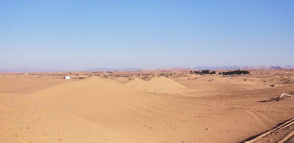 Scenic view of desert against clear sky