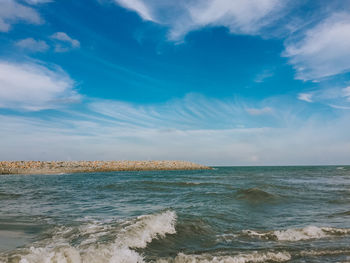 Scenic view of sea against blue sky