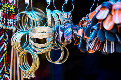 Close-up of bracelets and key rings for sale at street market