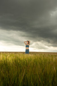 Full length of man standing on field