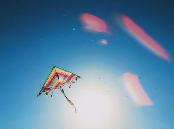 Low angle view of kite flying in sky