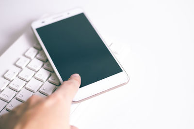 Close-up of hand using mobile phone