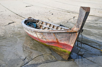 Longtail boat moored at beach