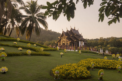 Temple by building against sky