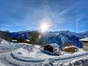 Snow covered mountains against sky during winter