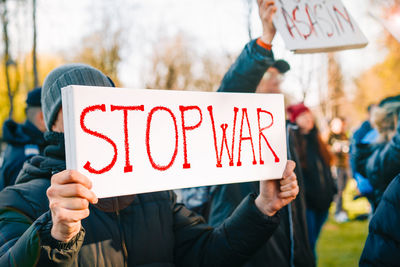 Protestors holding banners at anti-war rally