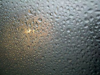 Close-up of water drops on glass window