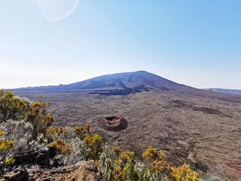 Scenic view of arid landscape against clear sky