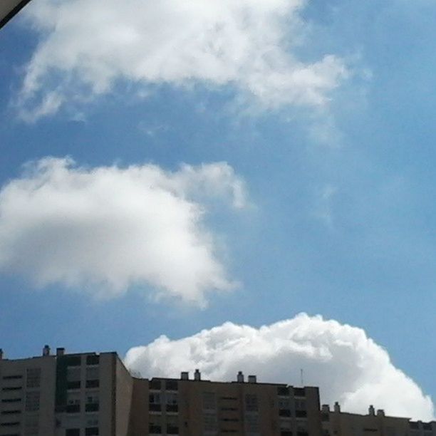 building exterior, architecture, built structure, low angle view, sky, cloud - sky, city, cloud, building, residential building, residential structure, cloudy, high section, day, outdoors, blue, no people, house, modern, window