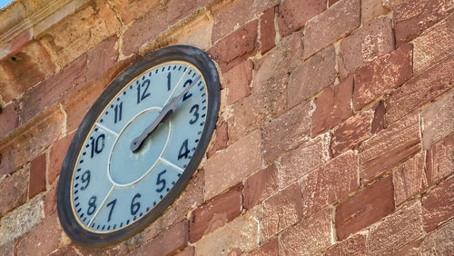 Close-up of clock on wall