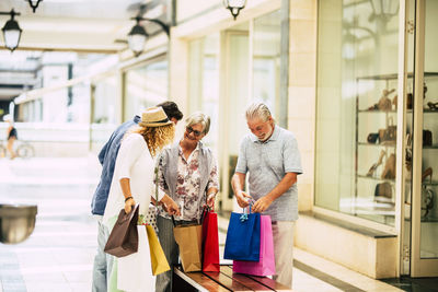 People standing on display at store