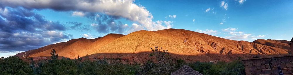 Panoramic view of mountain against cloudy sky
