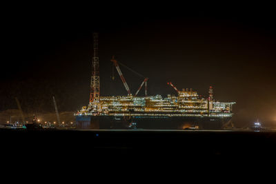 Illuminated ship at night