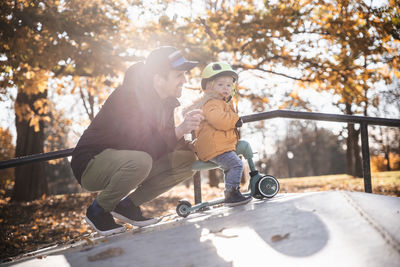 Side view of boy playing in park