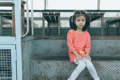 Little girl sitting on bus