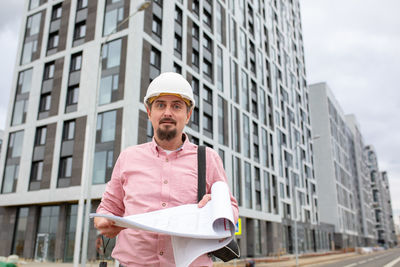 Mid adult man working at construction site in city