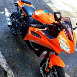 High angle view of motor scooter parked on road