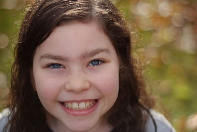Close-up portrait of smiling girl