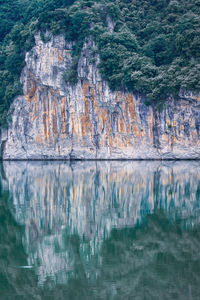 Reflection of rock formation in lake