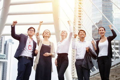 Group of people standing against the wall