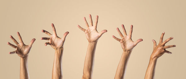Close-up of human hand against white background