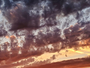 Low angle view of dramatic sky during sunset