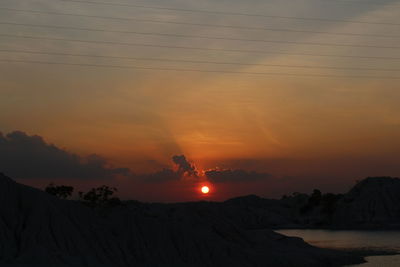 Scenic view of silhouette landscape against sky during sunset