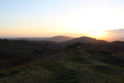 Scenic view of landscape against sky during sunset