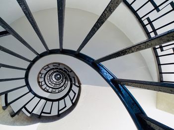 Low angle view of spiral staircase in building