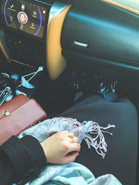 Midsection of man sitting in car