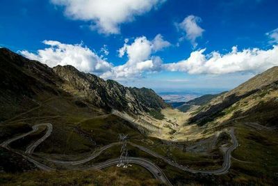 Scenic view of mountains against cloudy sky