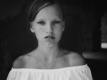 Portrait of girl wearing off shoulder top at home