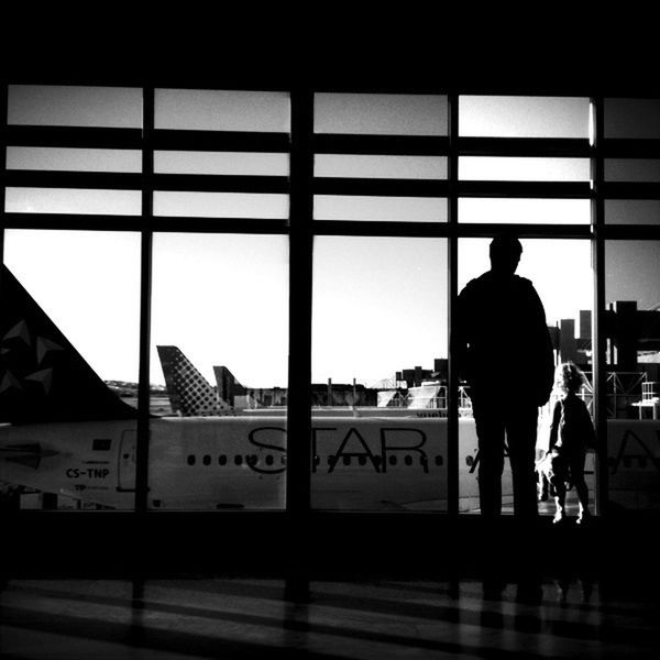 men, rear view, indoors, transportation, lifestyles, standing, silhouette, person, full length, clear sky, walking, architecture, built structure, glass - material, window, travel, public transportation