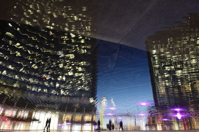 Low angle view of illuminated buildings at night