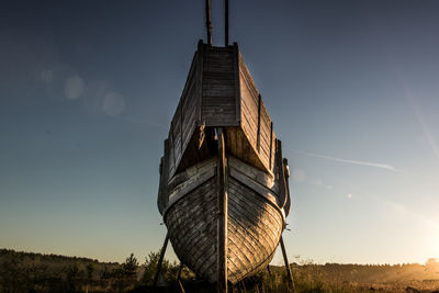 An old vikings boat staying on grass. russia, karelia. high quality photo