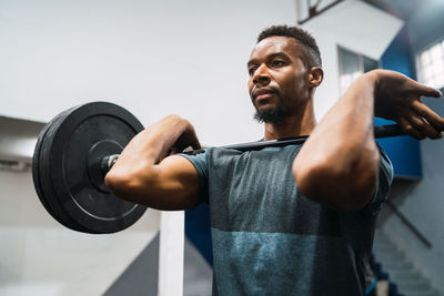 Man lifting weights in gym