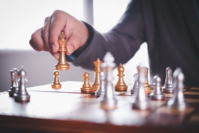 Low section of person playing on table