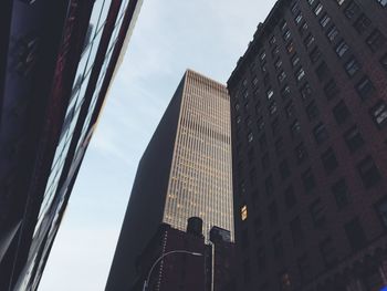 Low angle view of modern buildings against sky