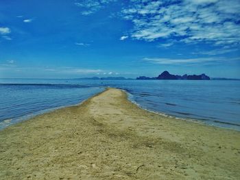 Scenic view of sea against cloudy sky