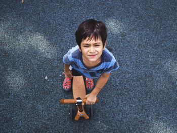 Portrait of boy boy scooter