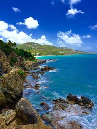 Scenic view of sea against blue sky