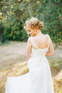 Rear view of bride standing outdoors