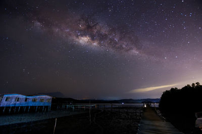 Scenic view of lake against sky at night