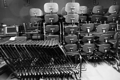 Tables and chairs arranged in room