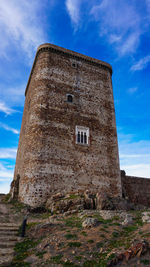 Low angle view of old building against sky