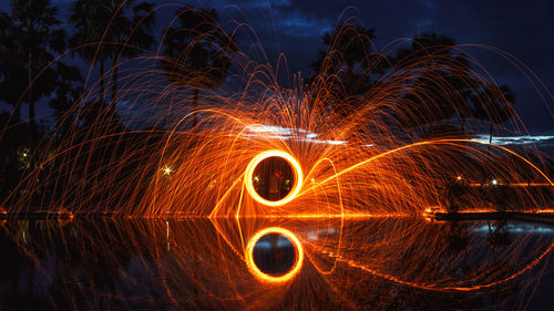 Light painting against sky at night