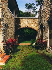 View of building and plants in garden
