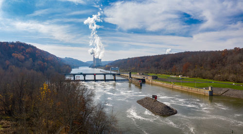 Bridge over river against sky