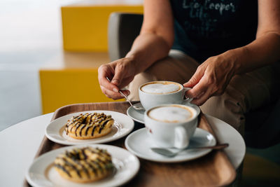 Midsection of woman having breakfast